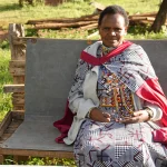 Emma Sintent seated outside her home in Namuncha Ranch, Kenya.